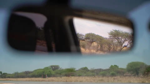 Rear view mirror in auto indoors. Car interior. Windshield, country dirt road. 스톡 동영상 168772252