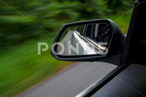 Rear View Mirror Of Driving Car