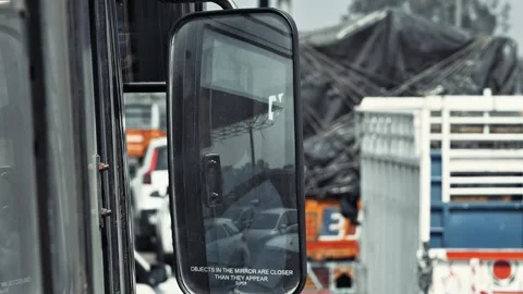 Rear View Mirror of Public Transport Bus Showing Road Reflection While Drivin Stock Footage 331340908