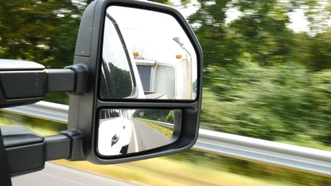 Rear view mirror truck pulling vintage silver RV Stock-Footage 118061453