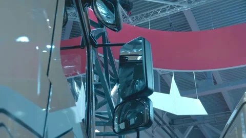 Rear-view mirrors on the doors of the new trucks are on display at exhibition Stockbeeldmateriaal 333416002