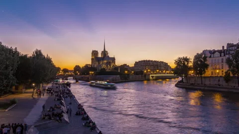 Rear view of Notre Dame De Paris cathedral day to night timelapse after sunset. Stock Footage 241326292