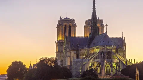 Rear view of Notre Dame De Paris cathedral day to night timelapse after sunset. Stock Footage 241326548