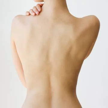 Rear view of nude woman Stock Photos