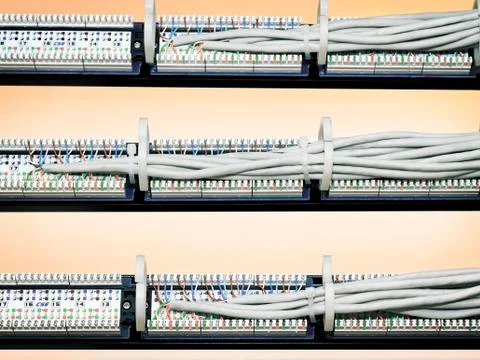 Rear view of a patch panel with wires Stock Photos