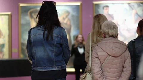 Rear view of people in gallery at excursion. Museum day and cultural education. Stock Footage 304581556