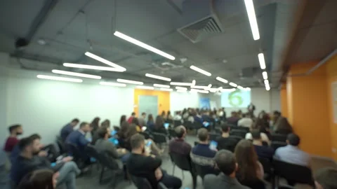 Rear view of people at a presentation, seminar or forum. Vídeos de archivo 200724201