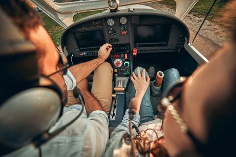 Rear view of pilot and copilot operating controls of private plane Stock Photos