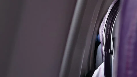 Rear view of plane seat inside aeroplane with selective focusing on seat wh.. Stock Footage 283629899
