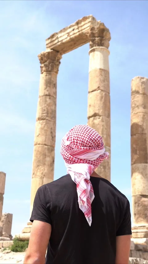 Rear view portrait of young guy with typical head cover in Jordan Stock Footage 270528960