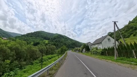 Rear view POV shot from a moving vehicle showing a clean asphalt road receding Vídeo Stock 346180992