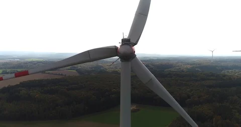 Rear view of the rotating wind turbine at the background of beautiful nature Stock Footage 87476516