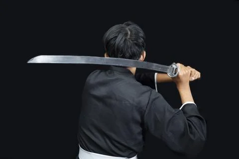 Rear view of a Samurai warrior holding the sword Stock Photos