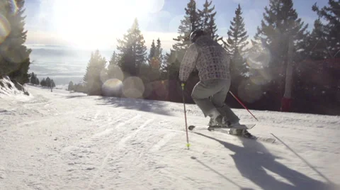 Rear View Of Skier Carving Down The Slope. Speed Ramp. Stock Footage 34520698