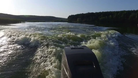 Rear view of speedboat and engine on the river Video stock 73980315