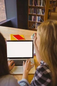 Rear view of students using laptop Stockfoto's