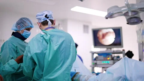 Rear view of surgeons in the operational room.  Stock Footage 251764501