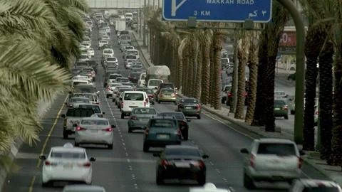 Rear view of traffic receding beneath an overhead road sign 库存影片 346425387