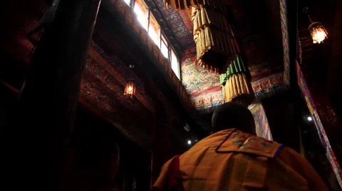Rear view of two monks sitting in monastery, Mustang, Nepal Stock Footage 62923878