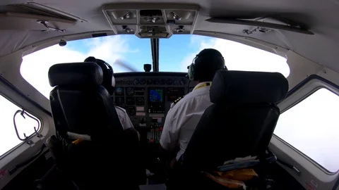 Rear View Of Two Pilots In Commercial Airplane Flight Cockpit Zanzibar Tanzania Stock Footage 90491670