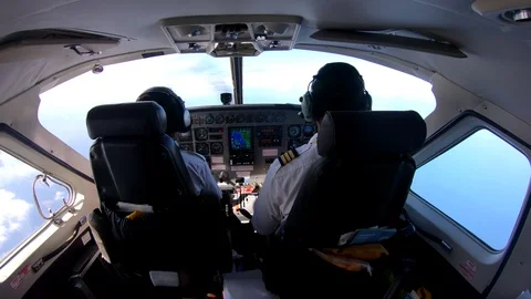 Rear View Of Two Pilots In Commercial Airplane Flight Cockpit Zanzibar Tanzania Stock Footage 90491706