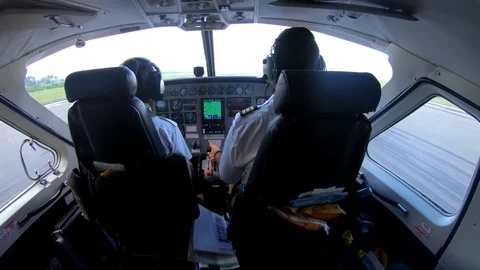 Rear View Of Two Pilots In Commercial Airplane Flight Cockpit Zanzibar Tanzania Stock Footage 90491765