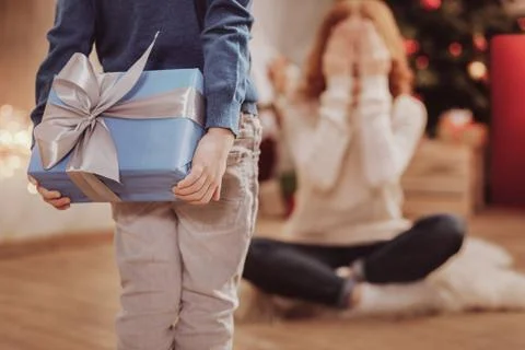 Rear view of unpredictable present for mother Stock Photos