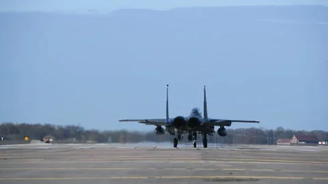 Rear view of U.S. Air Force F-15 Strike Eagle taking off with afterburner Stock Footage 256293255