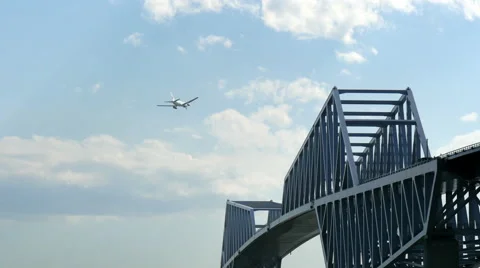 Rear view variation of a modern jet descending over the Tokyo Gate Bridge. Stock Footage 61773021