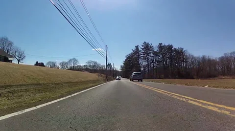 Rear view of a vehicle avoiding potholes Stock Footage 37995959