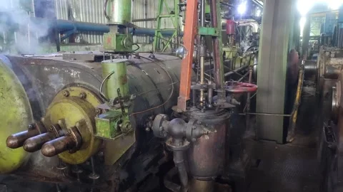 Rear view of a vintage steam engine in a sugar mill Stock Footage 309226482