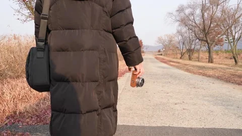Rear View Walking with Camera on Riverside Trail, Suncheon South Korea 스톡 동영상 324960830