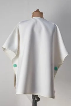 Rear view of white coat or cape. Autumn and winter ready Stock Photos