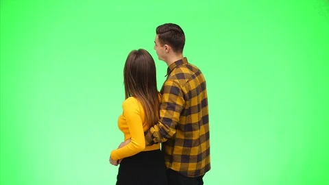 Rear view of young couple pointing fingers together. Close up. Copy space. 4K. Stock Footage 124367164