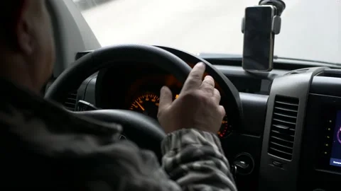 Rear view of a young man driving a car Stock Footage 197010746