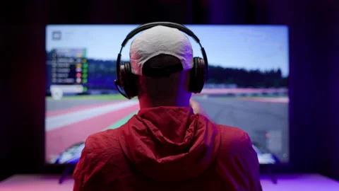 Rear view young Player video computer pc. Young man sitting on chair in game. Stock Footage 162375931