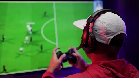 Rear view young Player video computer pc. Young man sitting on chair in game. Stock Footage 162376356
