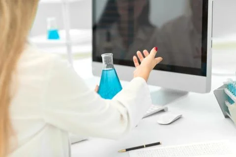 Rear view.female scientist working on a computer in the lab Foto stock