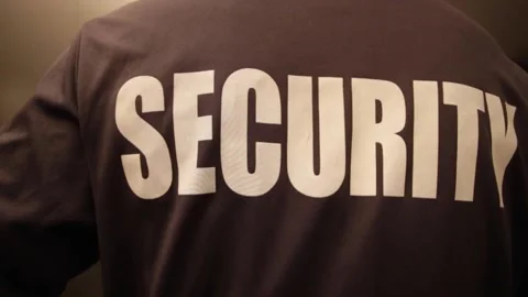 Rear views of security personnel inside an elevator in HD Stock Footage 154484648