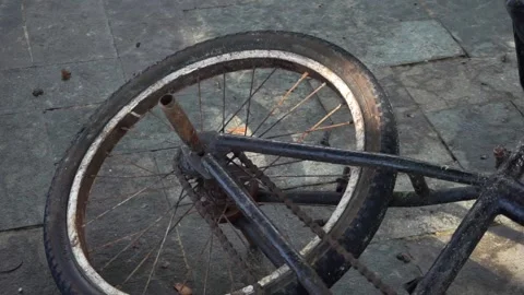 Rear Wheel of an Old Fallen BMX Bicycle in the Yard Stock Footage 314148116