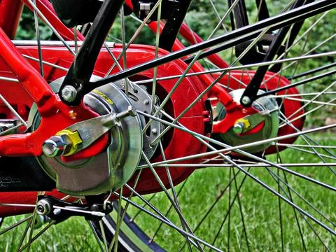 Rear wheels of two red bikes Stock Photos