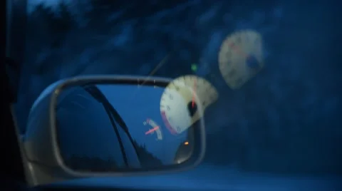 Rearview mirror car moving through the winter night forest Stockbeeldmateriaal 44292338