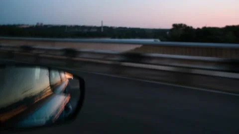 Rearview mirror of driving car, close-up. Summer travel by car. Close-up of the Stock Footage 212424746