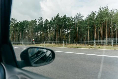 Rearview Mirror Reflection on Highway Stock Photos