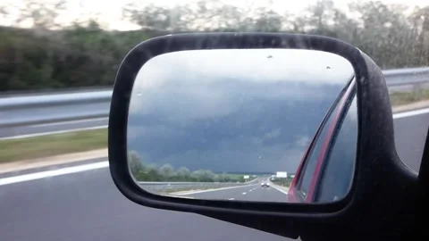 Rearview Mirror Reflection on Road, Car Driving, Dirty Mirror, Handheld Video Stock Footage 321861959