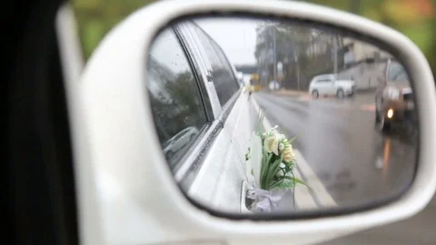 Rearview mirror of a wedding limousine Stock Footage 82503894