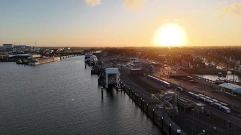 Rearward parallel flight with sunrise over harbor basin Stock Footage 331842085