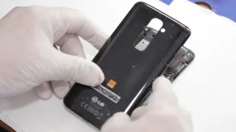 Reassembling phone by technician Stock Footage 61129720