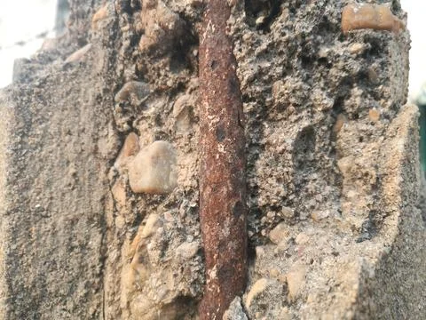 The rebar is rusty in the broken post. Stock Photos
