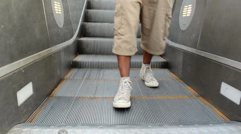 Rebel steps on escalator going countercurrent. 스톡 동영상 25746908